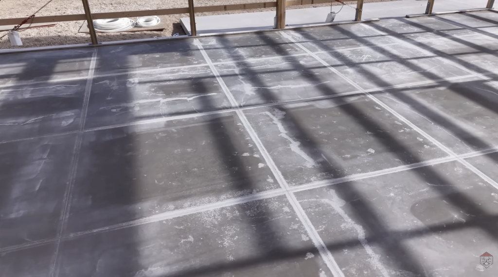 With the slab complete, control joints are cut to help guide natural shrinkage and prevent random cracking.